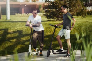 men riding e scooter - staying safe on an electric scooter and scooter injuries - viles and beckman - fort myers florida