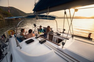 A boating accident lawyer explains maritime law to a group of people on a boat.