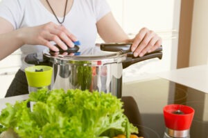 A woman injured while using a pressure cooker seeks legal help from a pressure cooker explosion lawyer.