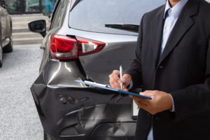 lawyer-fills-out-insurance-claim-after-car-accident