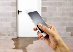 A personal injury victim takes a photo of a wet floor to prove negligence in a premises liability case.