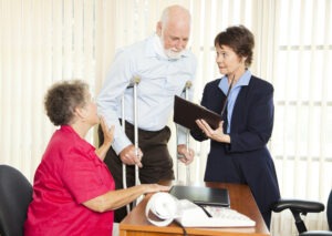 During a meeting with a Fort Myers premises liability lawyer, an injured client and his wife discuss fault in their premises liability case.