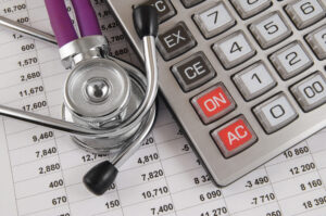 Stethoscope, medical bills, and calculator. Learn how medical expenses are calculated in trucking accident claims