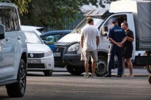 A group of individuals discussing how to file a claim against a trucking company after an accident.