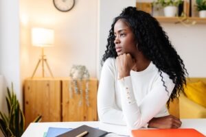 A woman wondering if she needs a car accident lawyer if she suffered no injury in a crash.