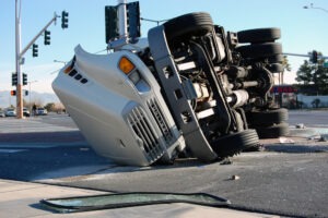 A truck is overturned in a traffic accident. Learn about non-economic damages in a truck accident claim.