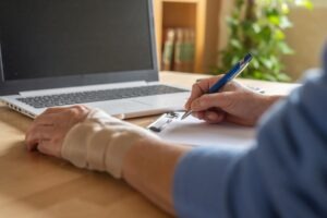 Person documenting their injuries. Learn how to document injuries after a truck accident