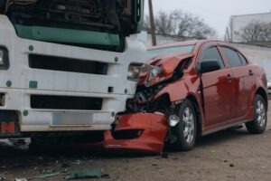 A truck colliding with a sedan. Learn about what economic damages are in a truck accident claim.
