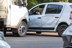 A truck and a damaged sedan after a crash. Learn about what evidence should be collected at the scene of a truck accident.