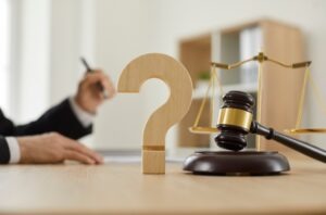 Legal questions concept. Learn when you should hire a truck crash lawyer.
