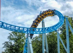 Amusement park scene with roller coaster “Can I Sue If My Child Was Injured at an Amusement Park?” legal topic